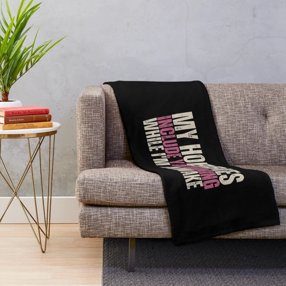 A cozy plush blanket with a funny 'yawning' quote