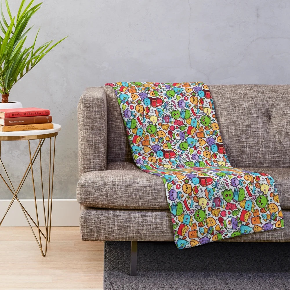 Plush blanket with colorful hobby-themed patterns and designs