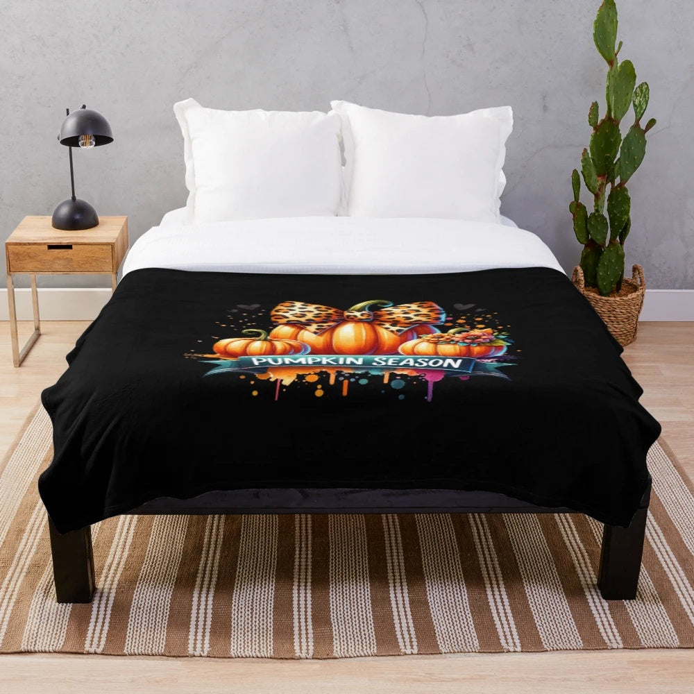 Plush blanket with a watercolor leopard pumpkin design for fall home decor