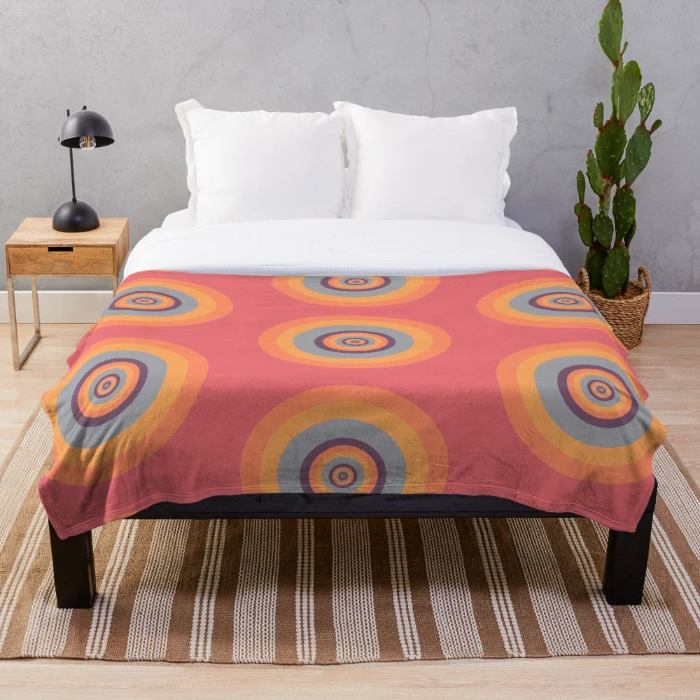 A cozy plush blanket featuring mesmerizing psychedelic fractal patterns.