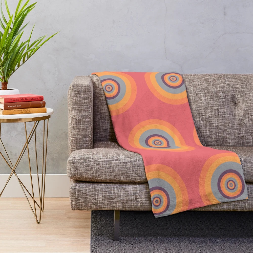 A cozy plush blanket featuring mesmerizing psychedelic fractal patterns.