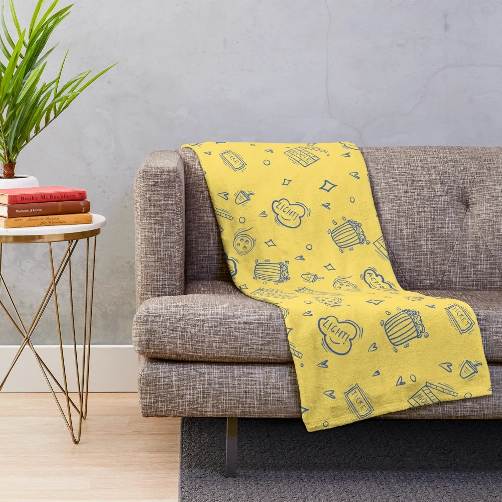 Plush blanket with retro movie and cinema inspired pattern