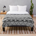 Plush blanket with vibrant American Samoa-inspired patterns