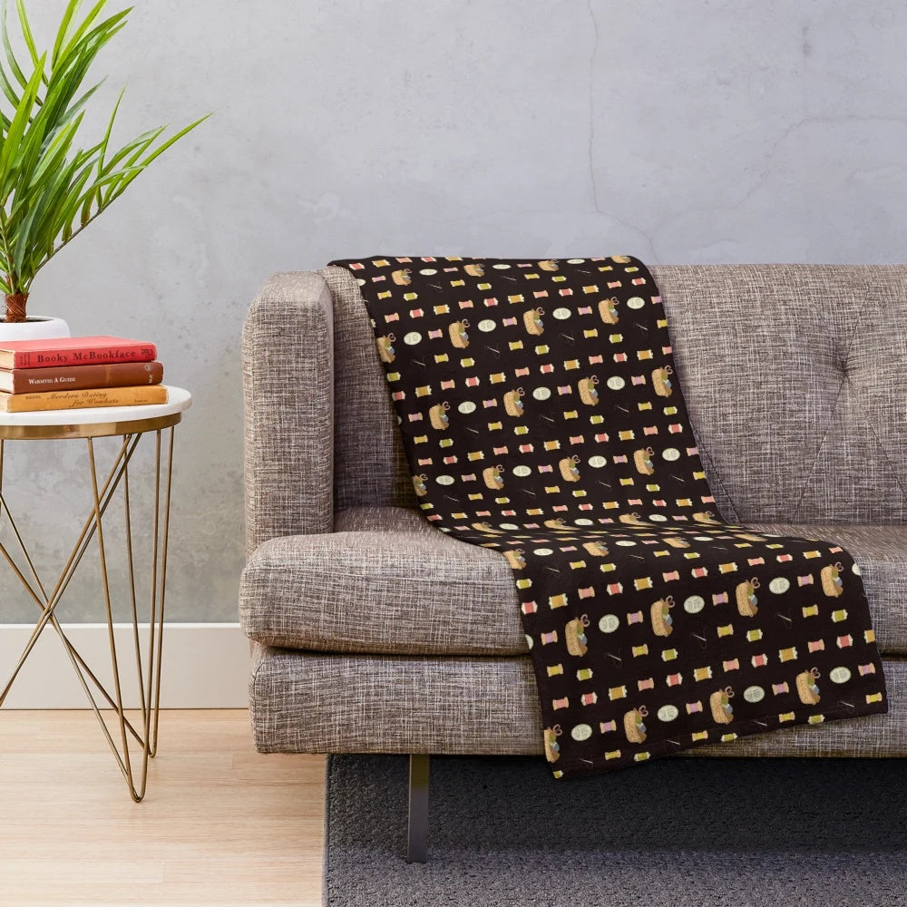 Colorful plush blanket featuring sewing-themed design