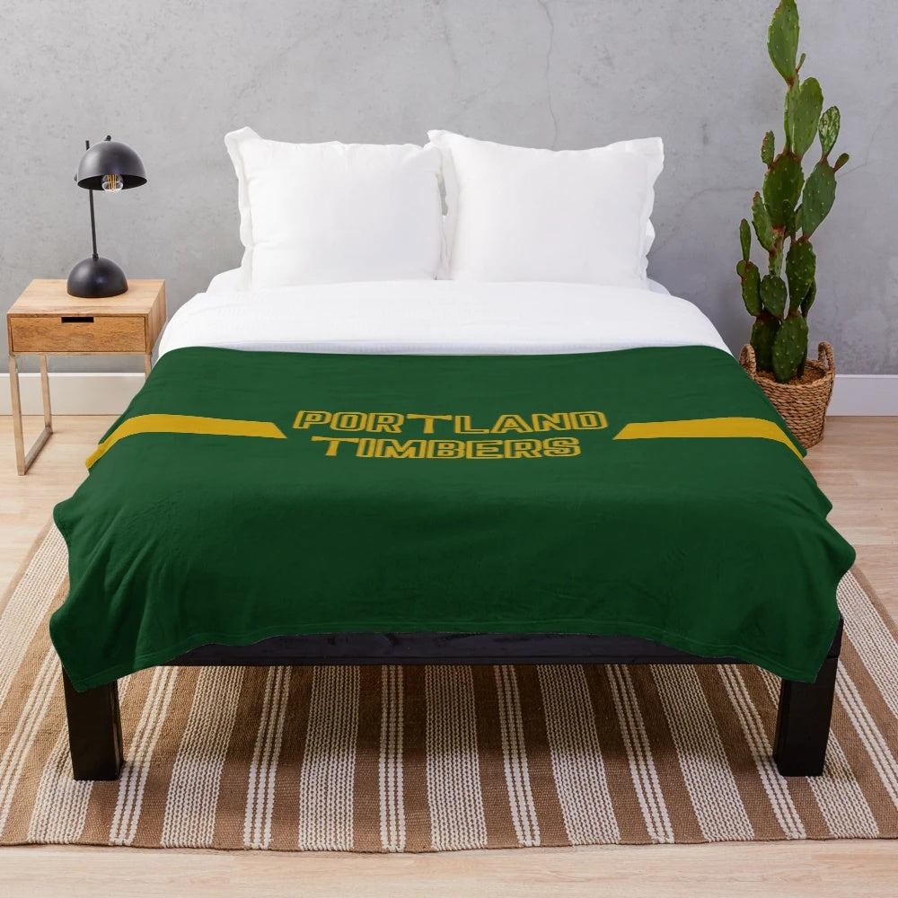 Portland Timbers-inspired plush blanket with team colors and logo