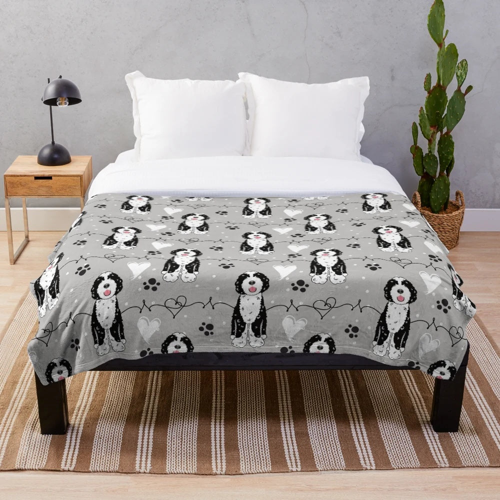 Soft and cuddly Portuguese Water Dog plush blanket with a black and white pattern