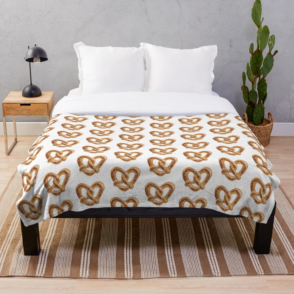 Soft plush pretzel-themed blanket with heart shapes
