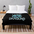 Plush dragon-themed blanket in a soft, purple color