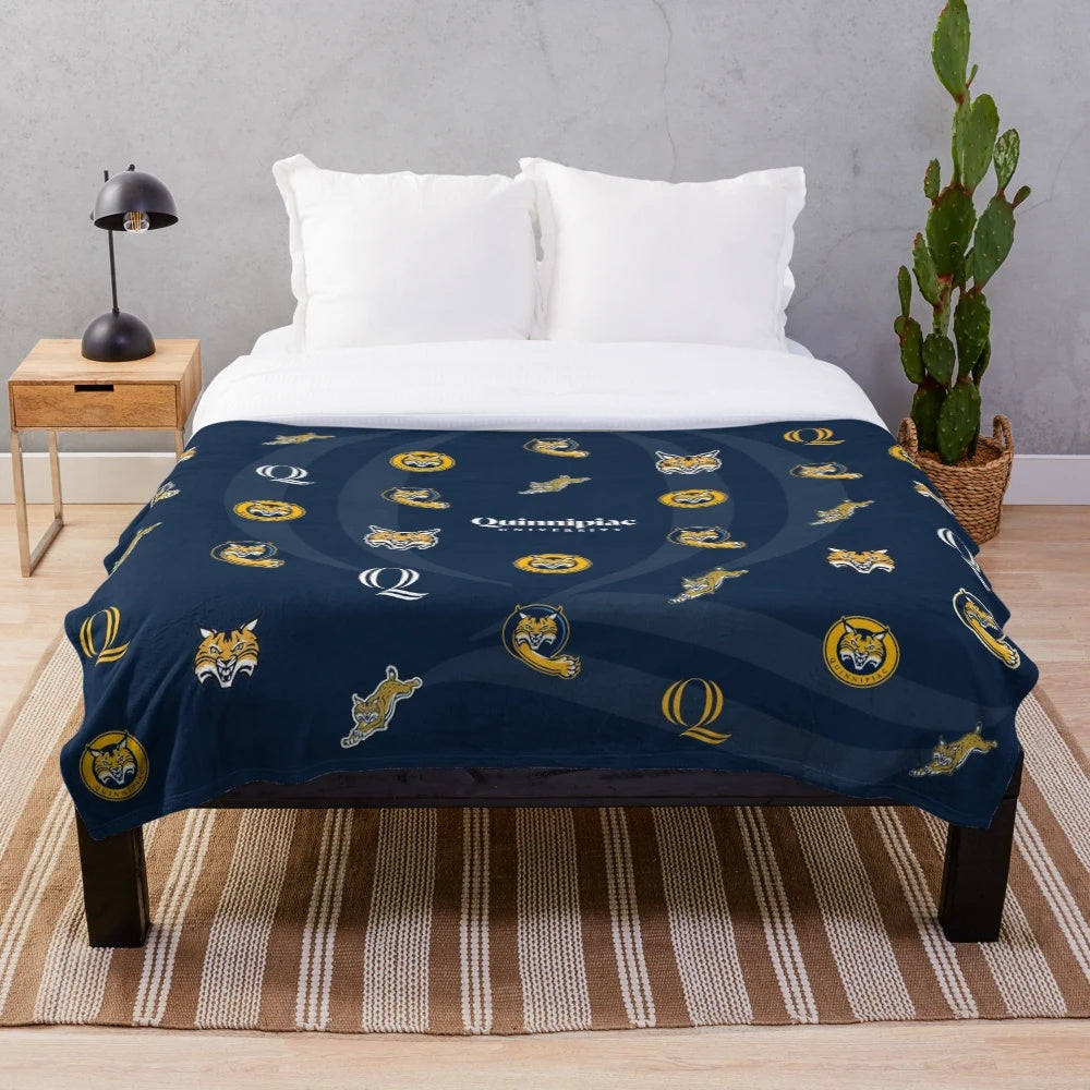 Quinnipiac Bobcats plush blanket featuring the university's logo in navy, blue and gold