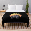 Racer-themed plush blanket for motorcycle and scooter lovers
