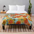 Vintage 70s flower power plush blanket in muted retro colors