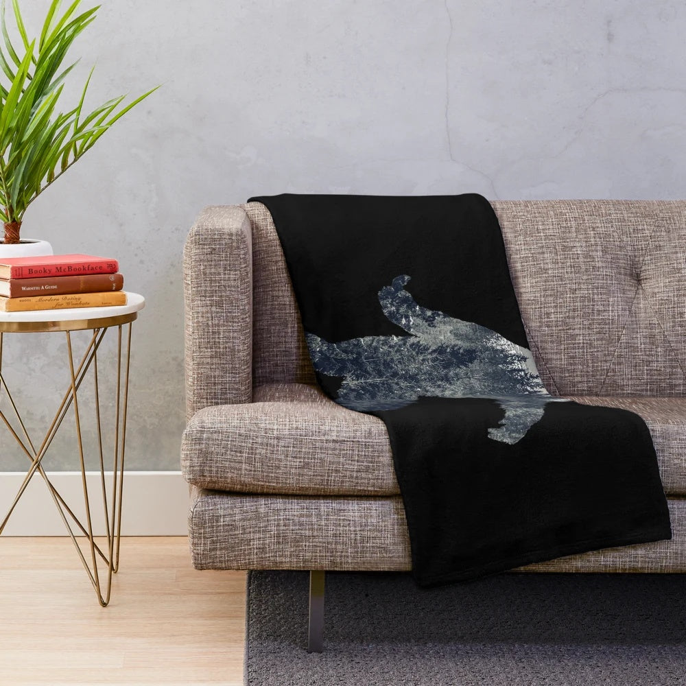 Sasquatch silhouette design on a cozy plush blanket