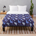 Soft and cuddly plush blanket featuring an adorable shark design in an underwater scene