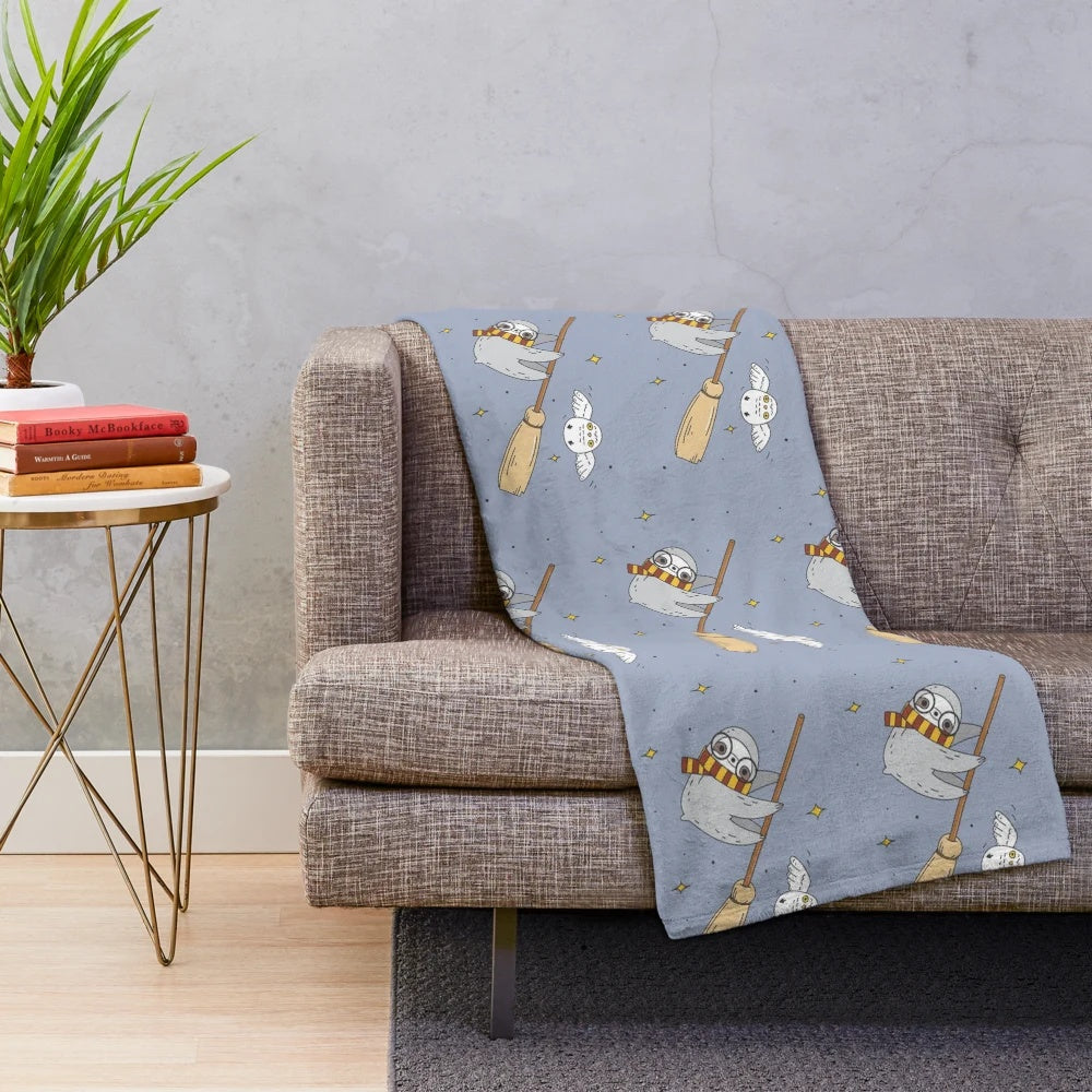 Soft and cuddly sloth plush blanket with a delightful owl illustration pattern