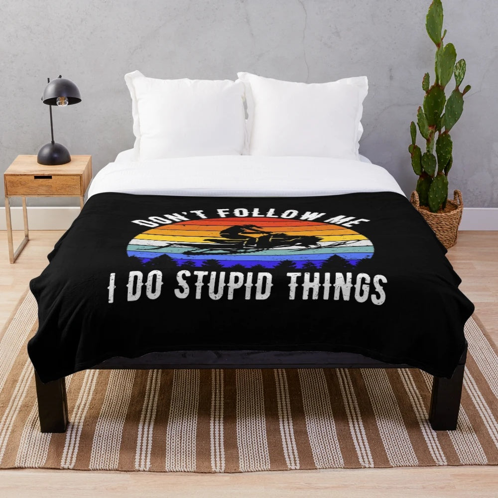 Snowmobile-themed plush blanket with a funny "Don't Follow Me I Do Stupid Things" vintage quote