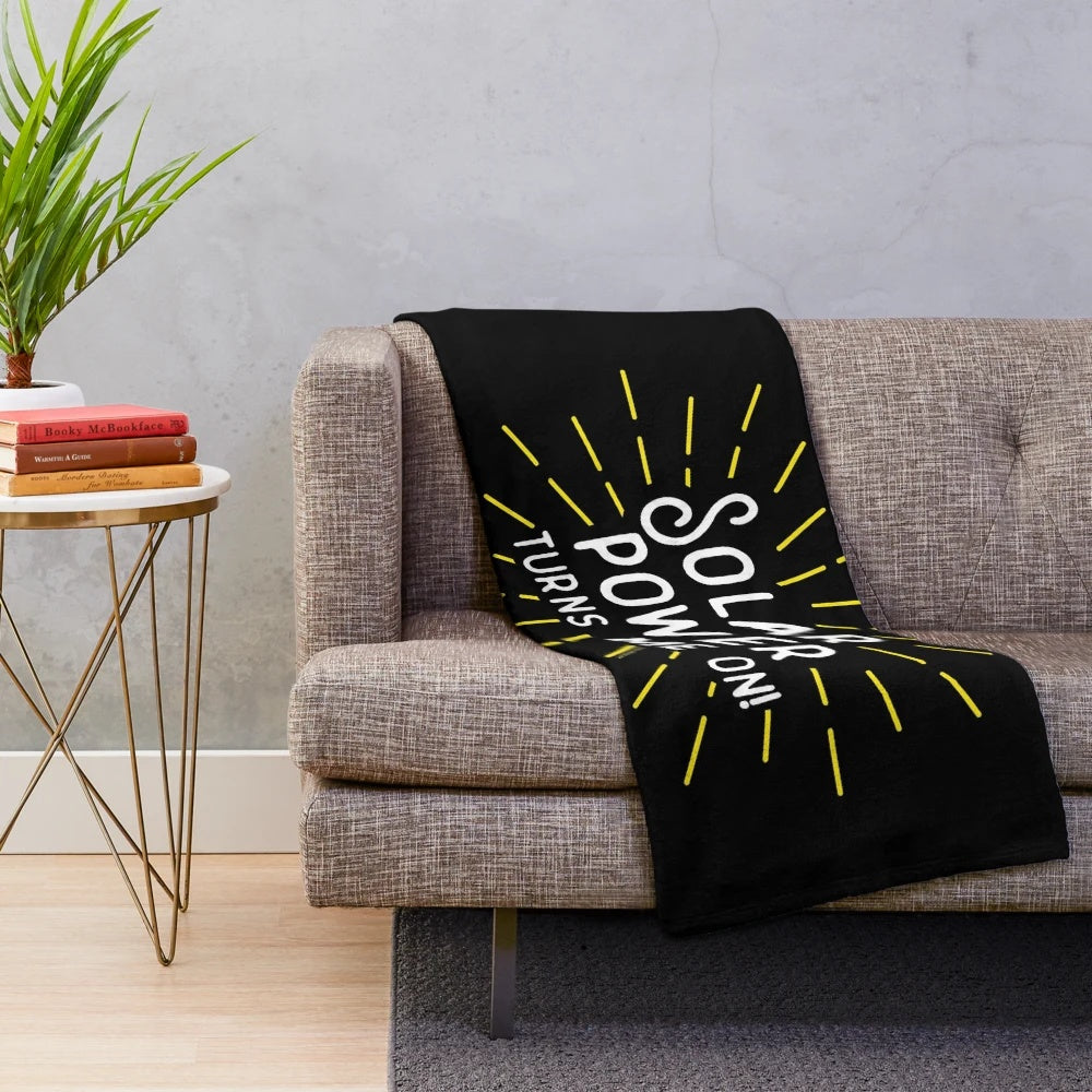 Cozy solar power plush blanket with retro sun and pun design