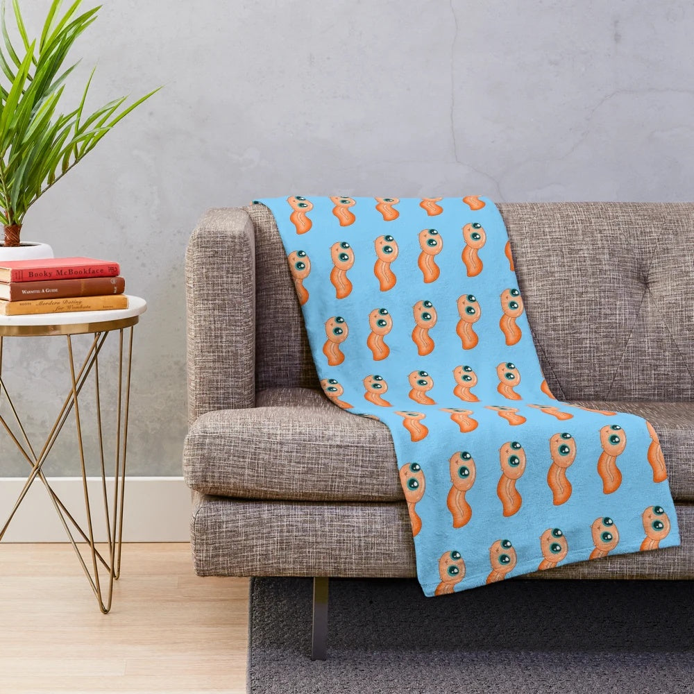 Orange tadpole plush blanket with cute amphibian design