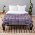 Soft and warm tartan-patterned plush blanket in shades of purple and grey