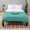 Soft plush blanket with "Teach Peace" design, perfect for educational settings and home decor.