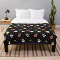 Cozy plush Halloween-themed blanket with tech and electronic design elements
