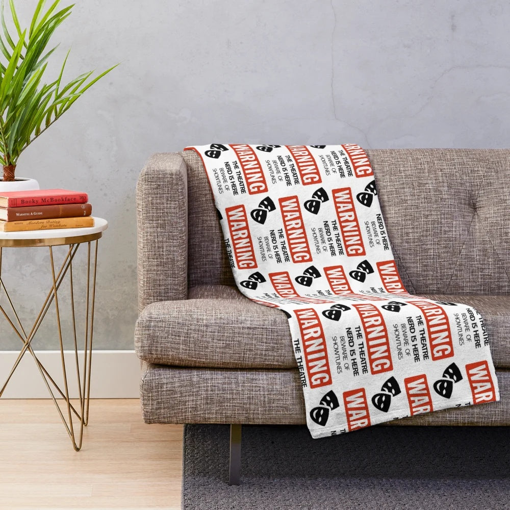 Plush theatre nerd blanket featuring show-themed designs for musical lovers