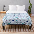 Soft and snuggly plush blanket featuring underwater sea life designs
