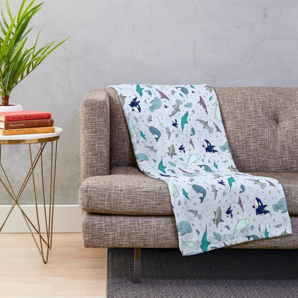 Soft and snuggly plush blanket featuring underwater sea life designs