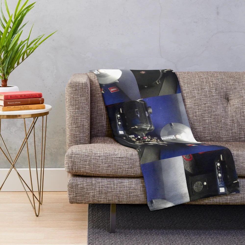 Plush blanket with an old-fashioned movie projector design