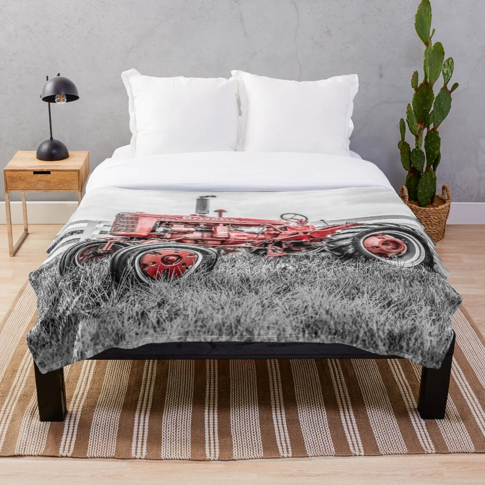 Plush blanket featuring a vintage tractor design for farm and country home decor