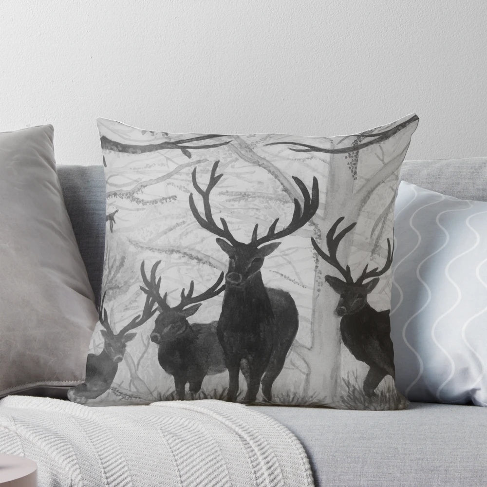 Decorative throw pillow featuring a soft, watercolor illustration of a deer in a winter forest scene.