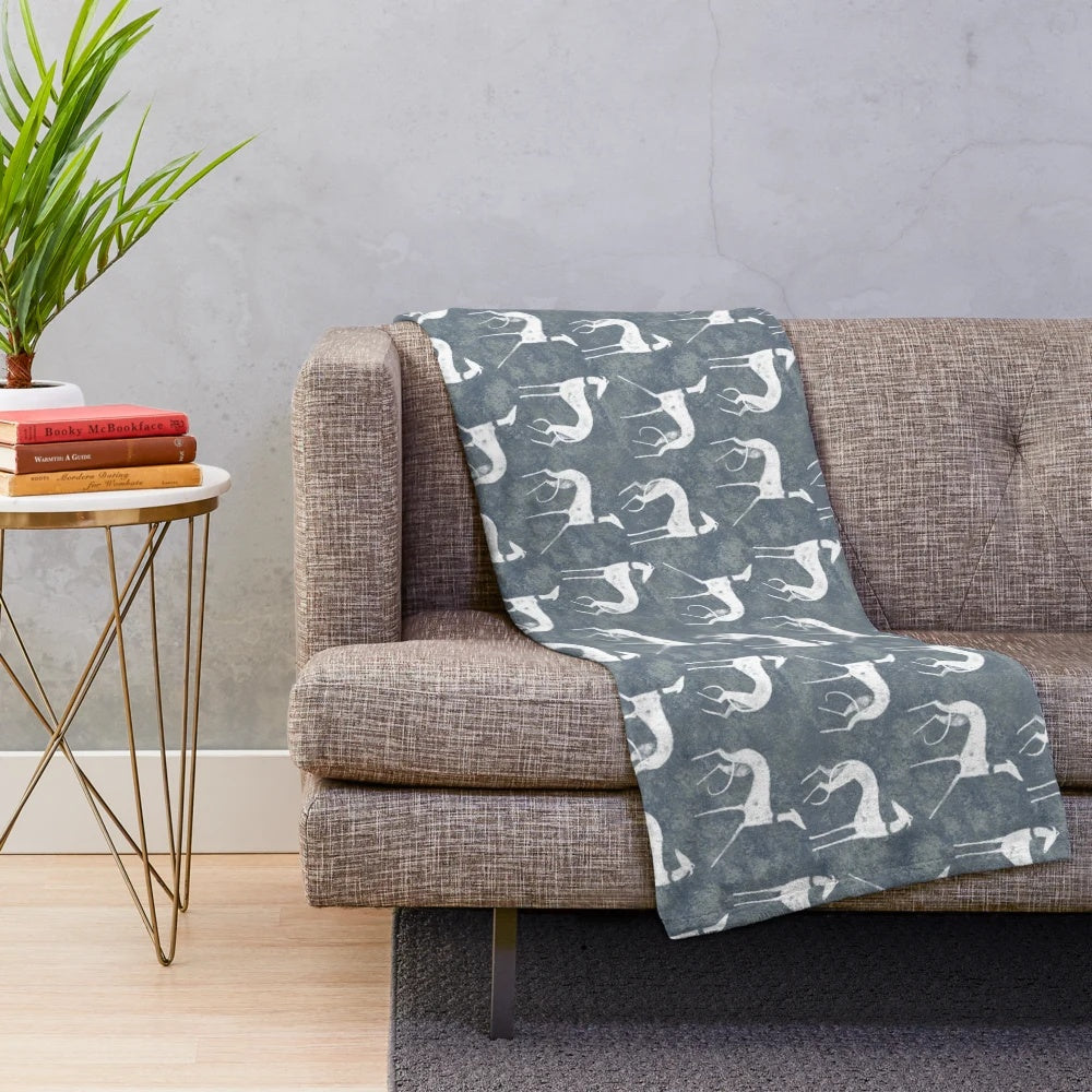 White plush blanket featuring a sighthound dog breed design