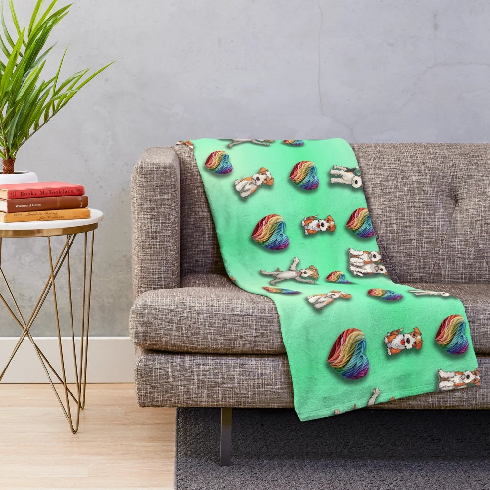Wire Haired Fox Terrier on a plush rainbow heart-patterned blanket