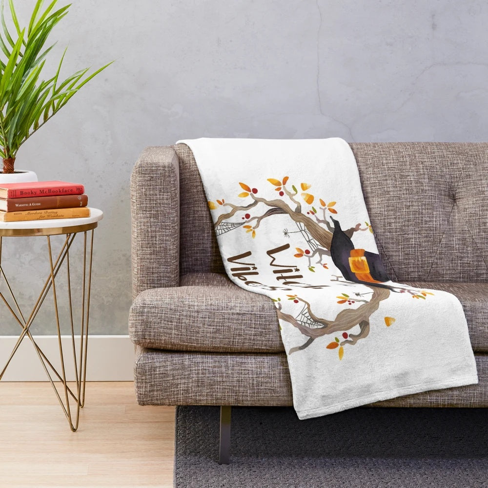 Cozy plush blanket with witch-themed design for fall and Halloween
