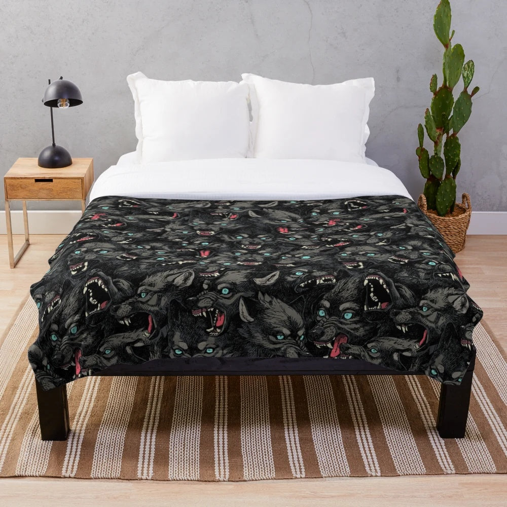 Gray wolf pack pattern printed on a soft, plush blanket
