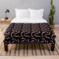 Soft and cuddly plush blanket with a worm design