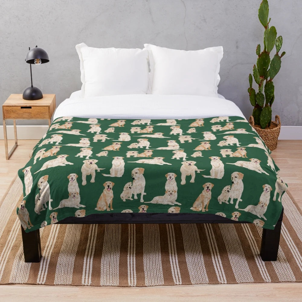 Yellow Labrador Retriever Puppy on Plush Green Blanket
