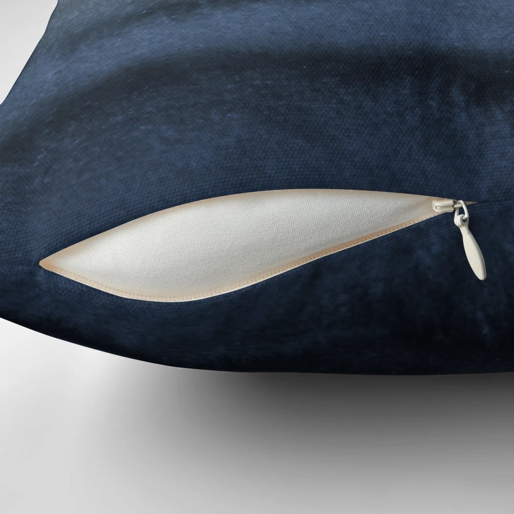 Crashing waves in a blue watercolor landscape design on a decorative pillow