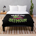 Creepy cute horror plush blanket featuring an Audrey plant inspired design