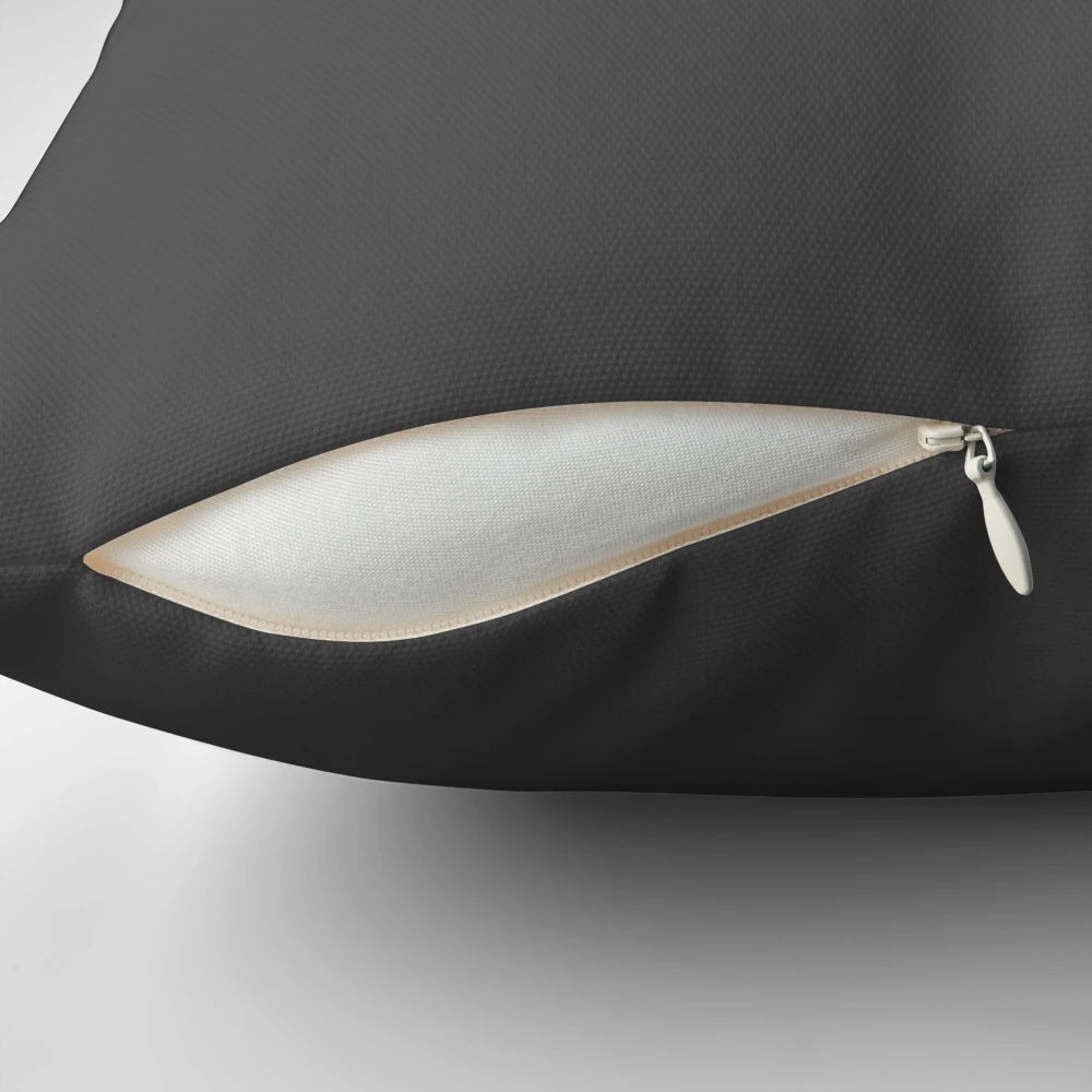 A decorative pillow featuring a cricket-themed design with a howzat, ball, and wicket.