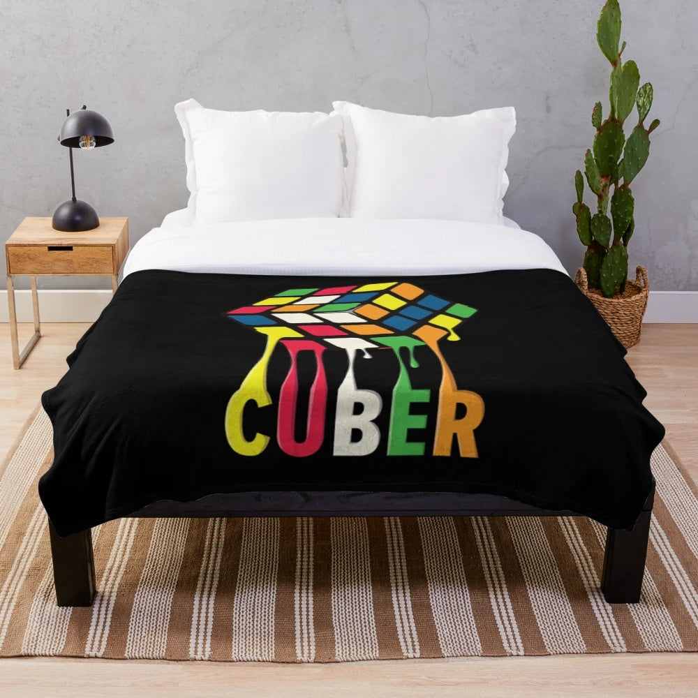 Plush blanket with a Rubik's cube-inspired colorful geometric pattern