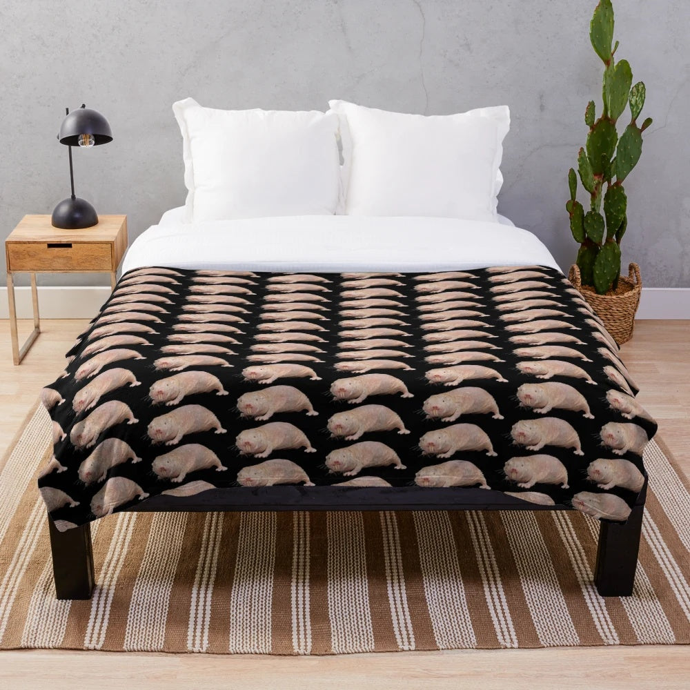 Soft and cuddly plush blanket featuring a cute mole rat design