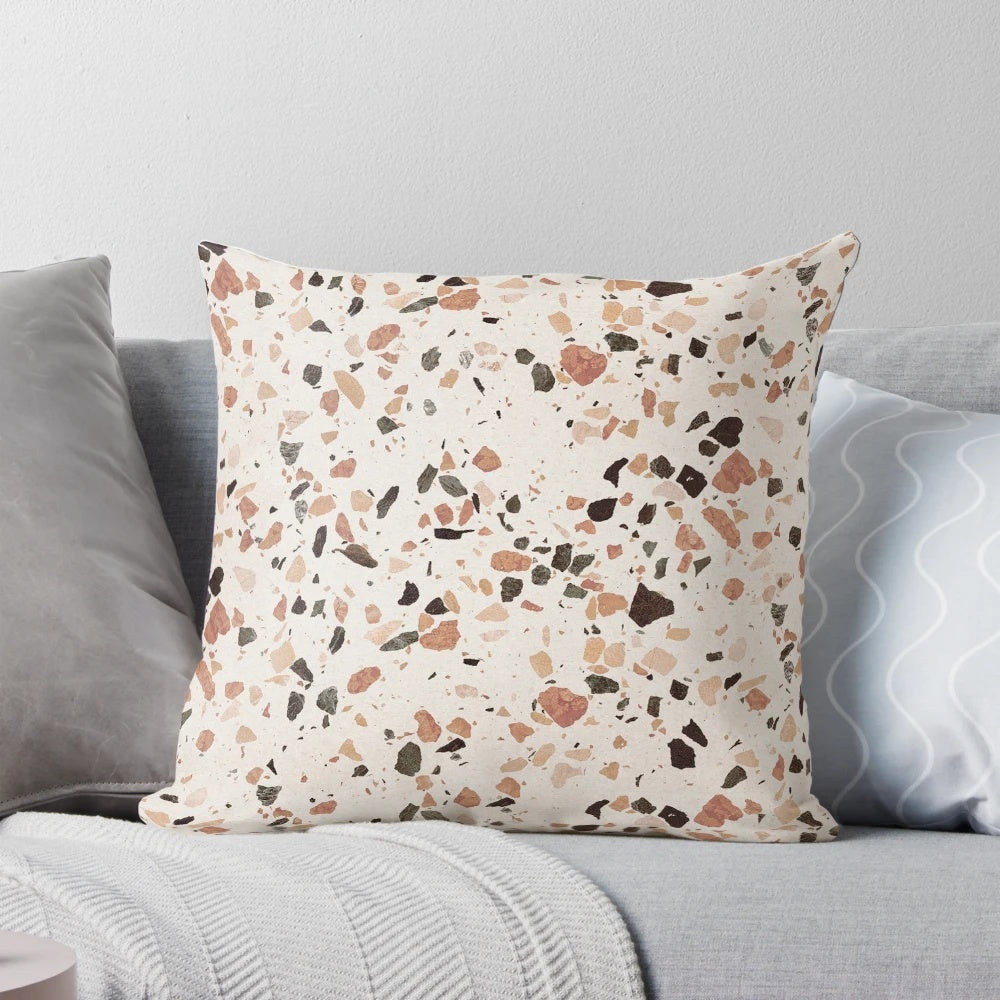 Terrazzo textured decorative pillow in earthy tones