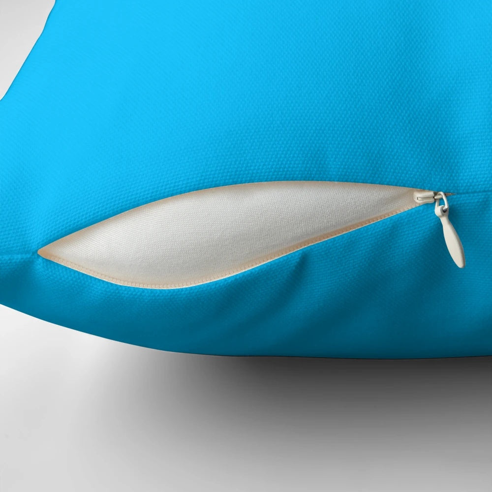 Deep sky blue solid color pillow with a plain, monochrome design