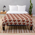 Soft and cozy plush blanket featuring a chocolate swiss roll cake pattern