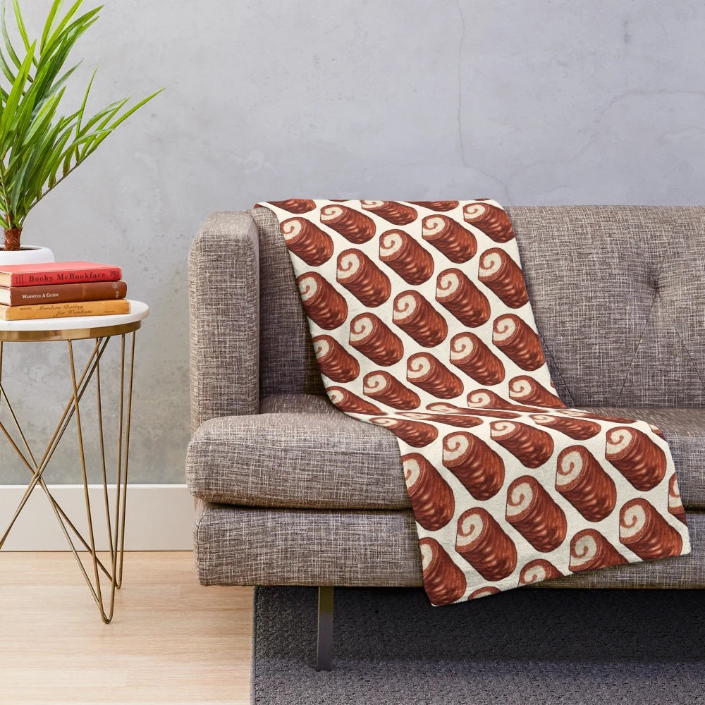 Soft and cozy plush blanket featuring a chocolate swiss roll cake pattern