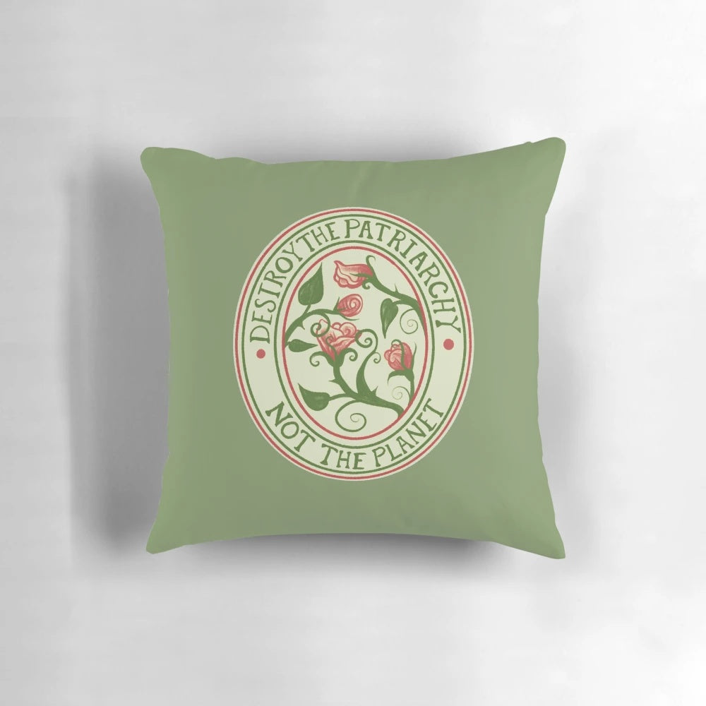 Vintage-style pillow with text "Destroy the Patriarchy, Not the Planet" and floral design.