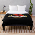 Jurassic Park themed plush blanket with dinosaur design