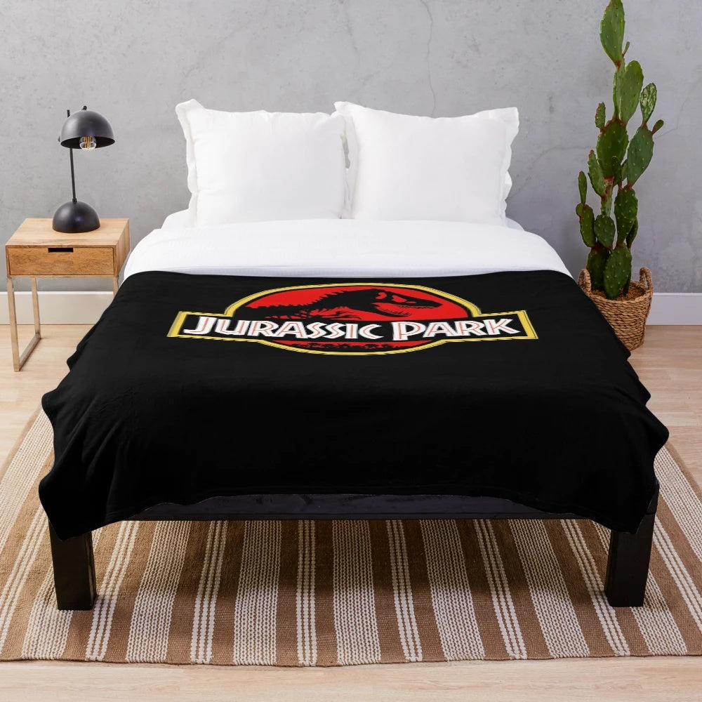 Jurassic Park themed plush blanket with dinosaur design