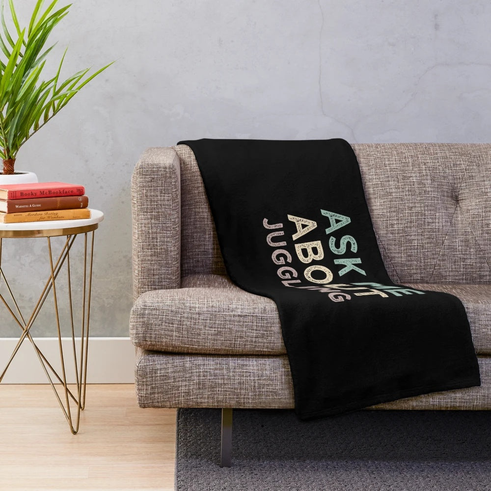 Plush blanket with juggling-themed design