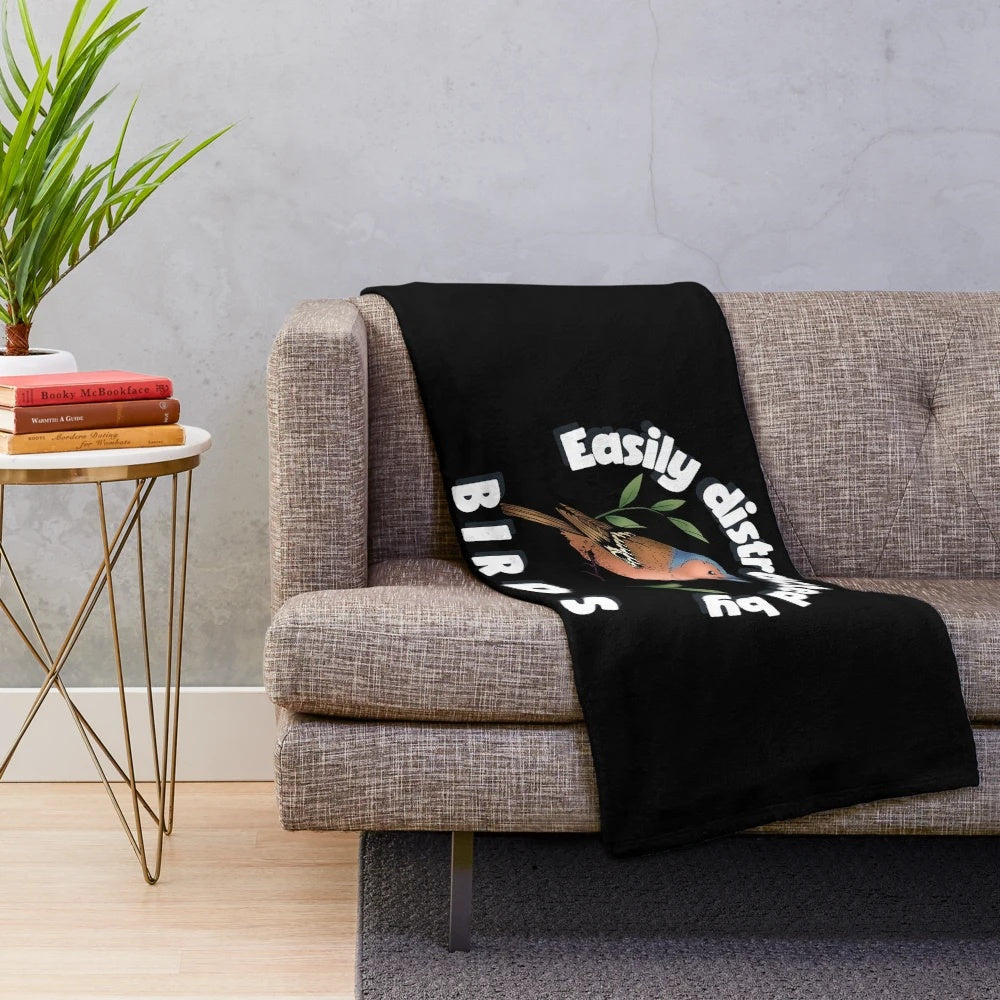Plush blanket with a humorous "easily distracted by birds" design for bird enthusiasts